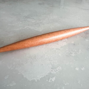 Smooth wooden rolling pin, tapered at each end